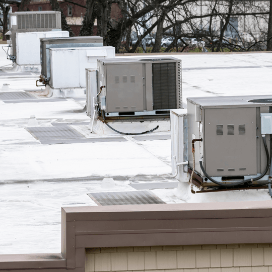 Commercial HVAC units on top of a roof